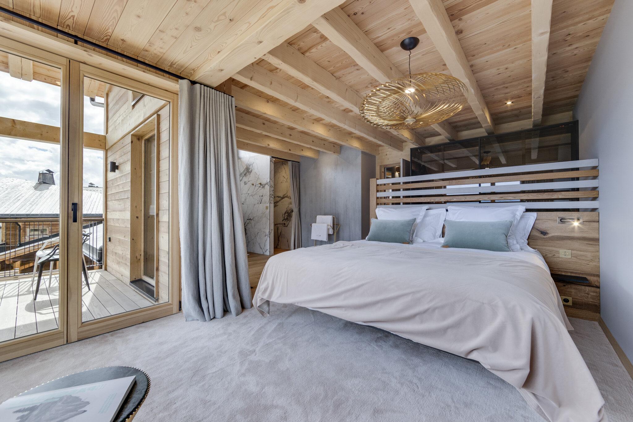 Une chambre dans le chalet à louer © Chalets Béla Vya 